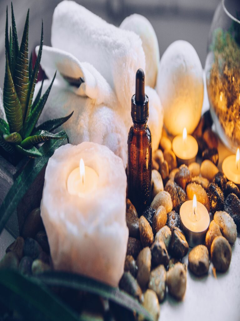 Relaxing spa items like candles and stones for a tranquil experience.