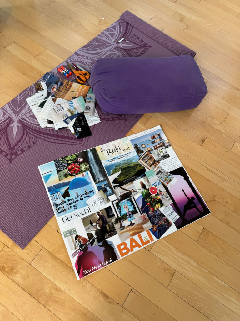 a reiki vision board and a purple mat on a wooden floor