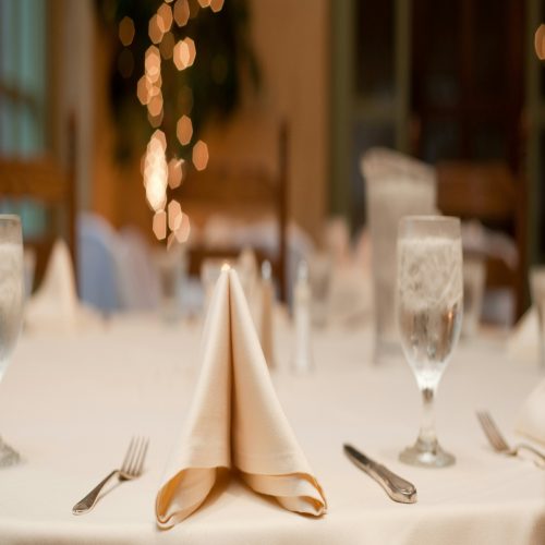 Elegant table setting with napkins and silverware.