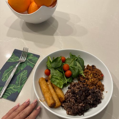 Delicious meal on kitchen counter plate with colorful veggies, juicy steak