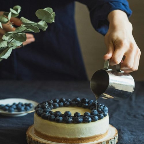 Image of someone preparing cake.