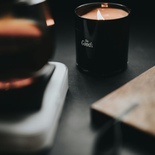 A candle elegantly displayed on a table.